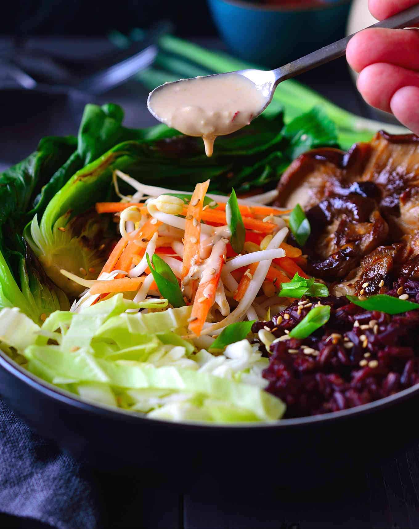 This forbidden rice bowl with bok choy, shiitake mushrooms, crispy vegetables and sesame-ginger sauce is all you need for an easy, healthy and filling vegetarian or vegan dinner. 