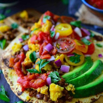This recipe for vegan egg and chorizo tacos is not only quick and easy to put together, they also freeze well for make-ahead vegan breakfast tacos any day of the week. Think tacos for breakfast is weird? Well, these tacos are so good you’re gonna want to have them for lunch and dinner too!