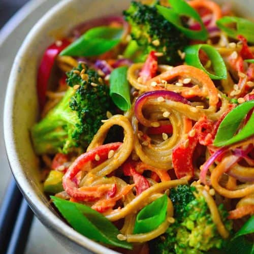 These almond butter noodles are deliciously creamy, quick and easy to make, and packed with a rainbow of veggies. I used soba noodles for this vegan recipe but it works equally well with udon, rice noodles, zoodles or even simple spaghetti.