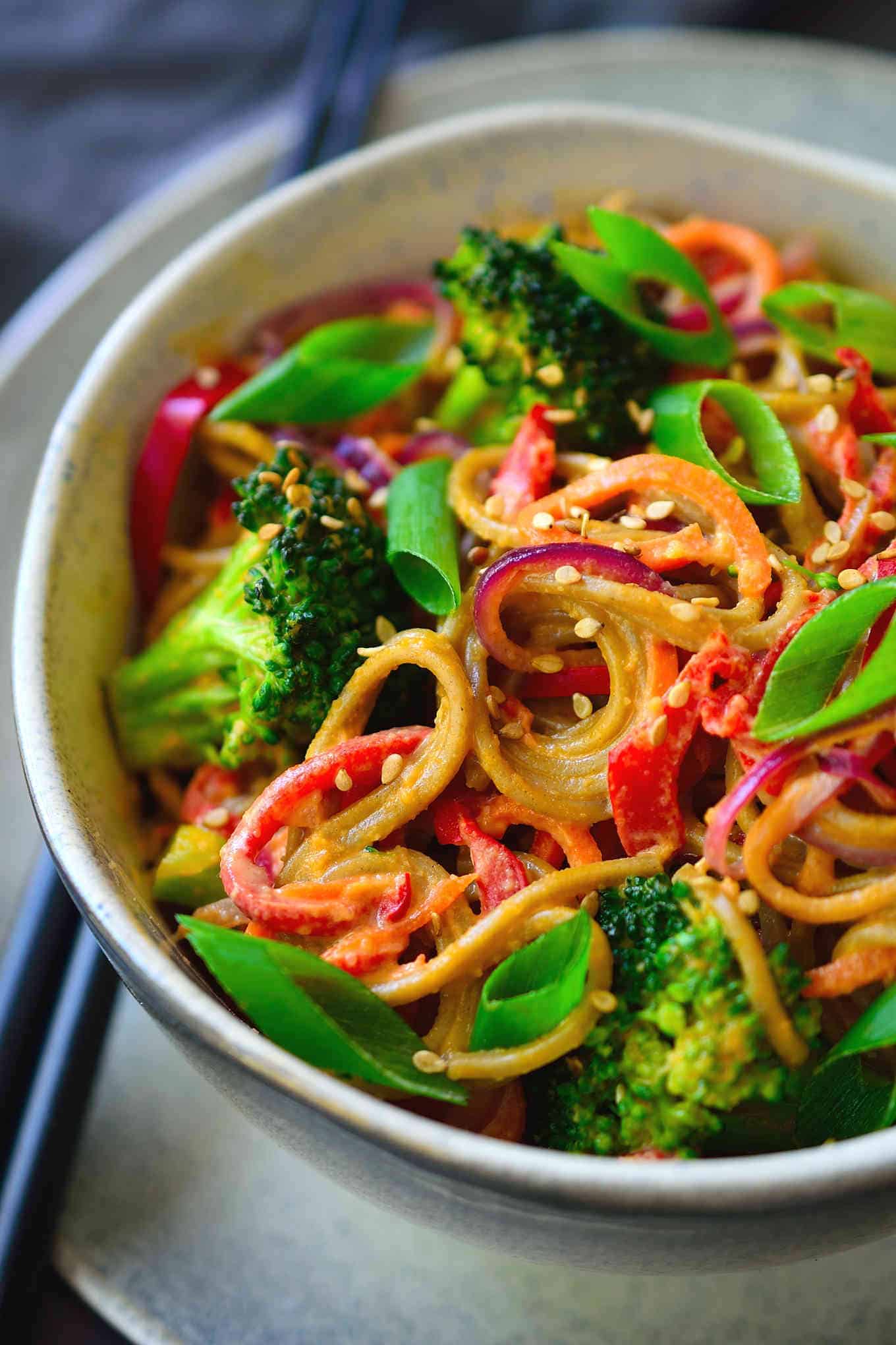 These almond butter noodles are deliciously creamy, quick and easy to make, and packed with a rainbow of veggies. I used soba noodles for this vegan recipe but it works equally well with udon, rice noodles, zoodles or even simple spaghetti.