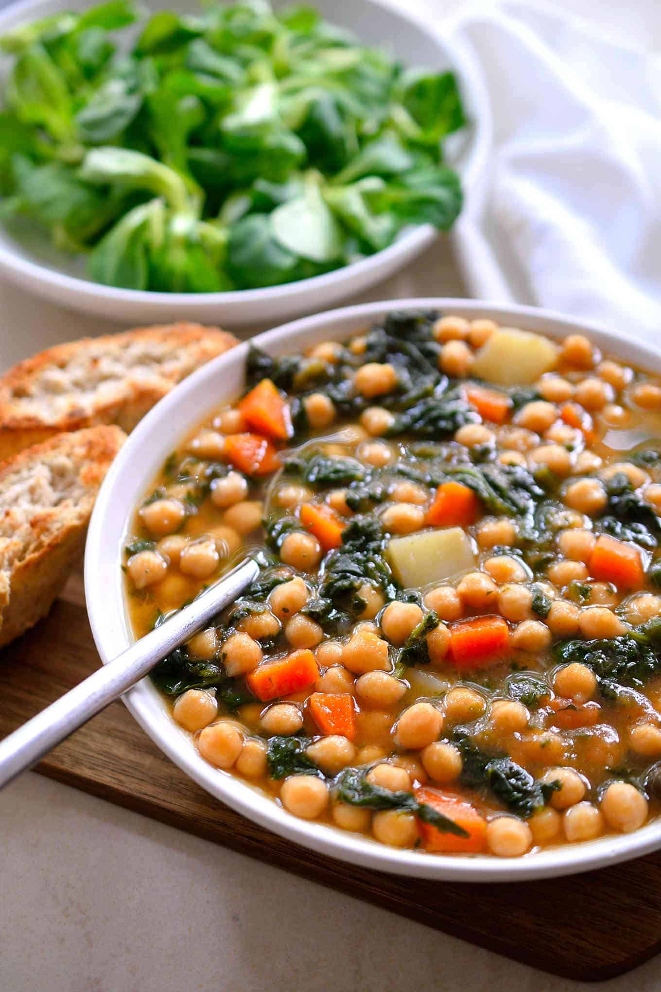 This Spanish chickpea stew can be made with canned chickpeas for a quick 20-minute meal or dried chickpeas for a dirt cheap dinner.