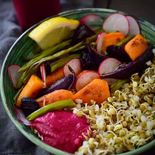 This sprouted lentil vegan Buddha bowl is hearty and flavourful with roasted vegetables and a creamy beet and tahini sauce. Easy to make and packed with the nutritional goodness of sprouted lentils, this vegan Buddha bowl is budget friendly at only $1.62 a serving!