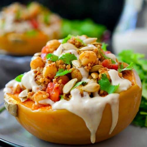 This vegan stuffed squash is a whole meal in just one dish. Hearty and flavourful roasted squash is filled to the brim with couscous and chickpeas tossed in a mix of delicious warming spices and topped off with a tasty tahini-date sauce. An impressive and flavourful vegan or vegetarian main dish for just $1.70 a serving!