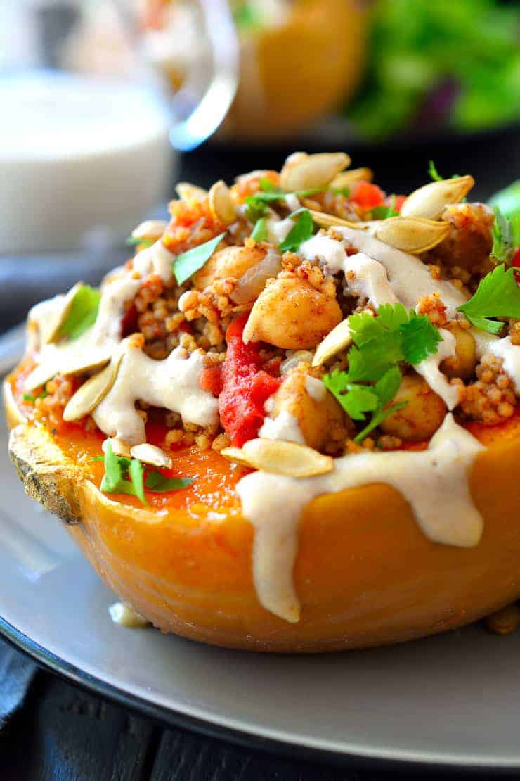 Vegan stuffed squash with couscous and Moroccan spices. A delicious, warming vegetarian dish!