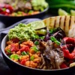 This vegan Mexican rice fajita bowl is full of flavour with a base of tomato rice, grilled vegetables and a dollop of guacamole. Easy to make and hearty, these bowls can be made ahead to pack for lunch and cost just $1.80 a serving!