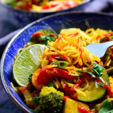 Vegetable Singapore noodles are super easy to make with curried rice vermicelli, pan-seared tofu and a rainbow of veggies. A quick and easy dish perfect for a weeknight dinner!