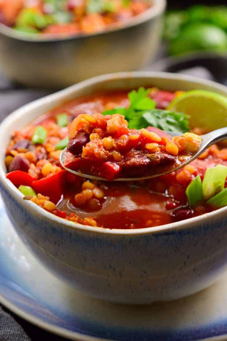This vegan red lentil chili is oil-free, quick and easy to prepare and full of flavour Customize it with your favourite veggies and toppings! 