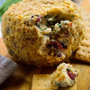 This cranberry rosemary vegan cheese ball is a great make-ahead appetizer for festive occasions or any old day of the week! Deliciously sweet and savoury, super easy to make and great served with crackers, fruit of veggies, this vegan cheese ball will be a great addition to your holiday table!