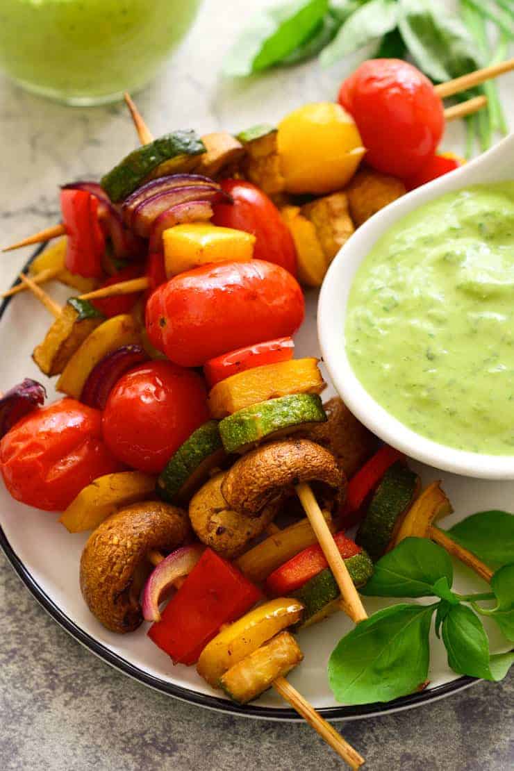 Veggie skewers after baking in the oven and on a plate.