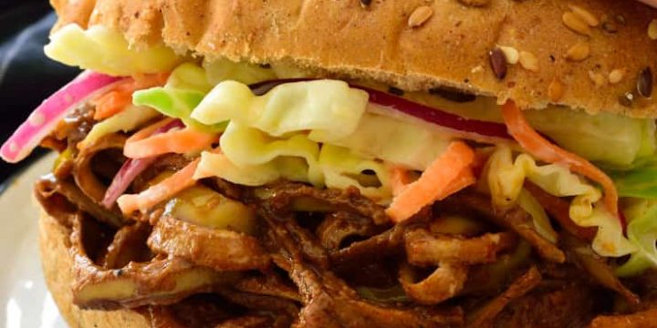 A banana peel vegan pulled pork sandwich on a plate.