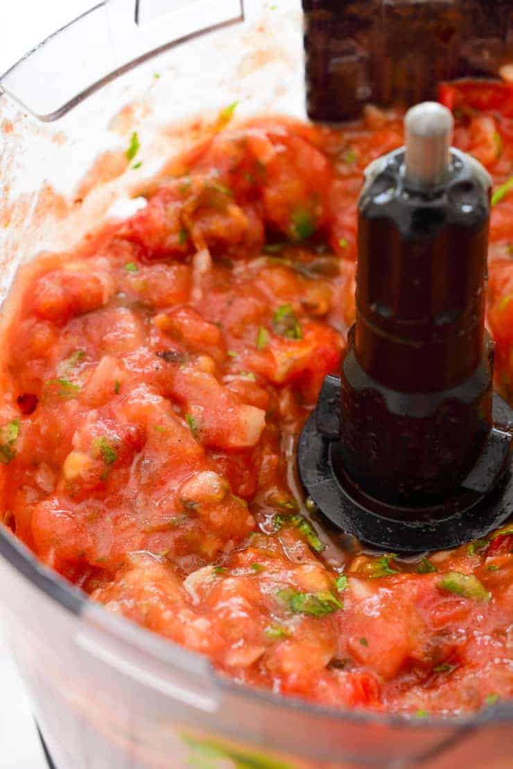 The pulsed salsa inside the food processor.