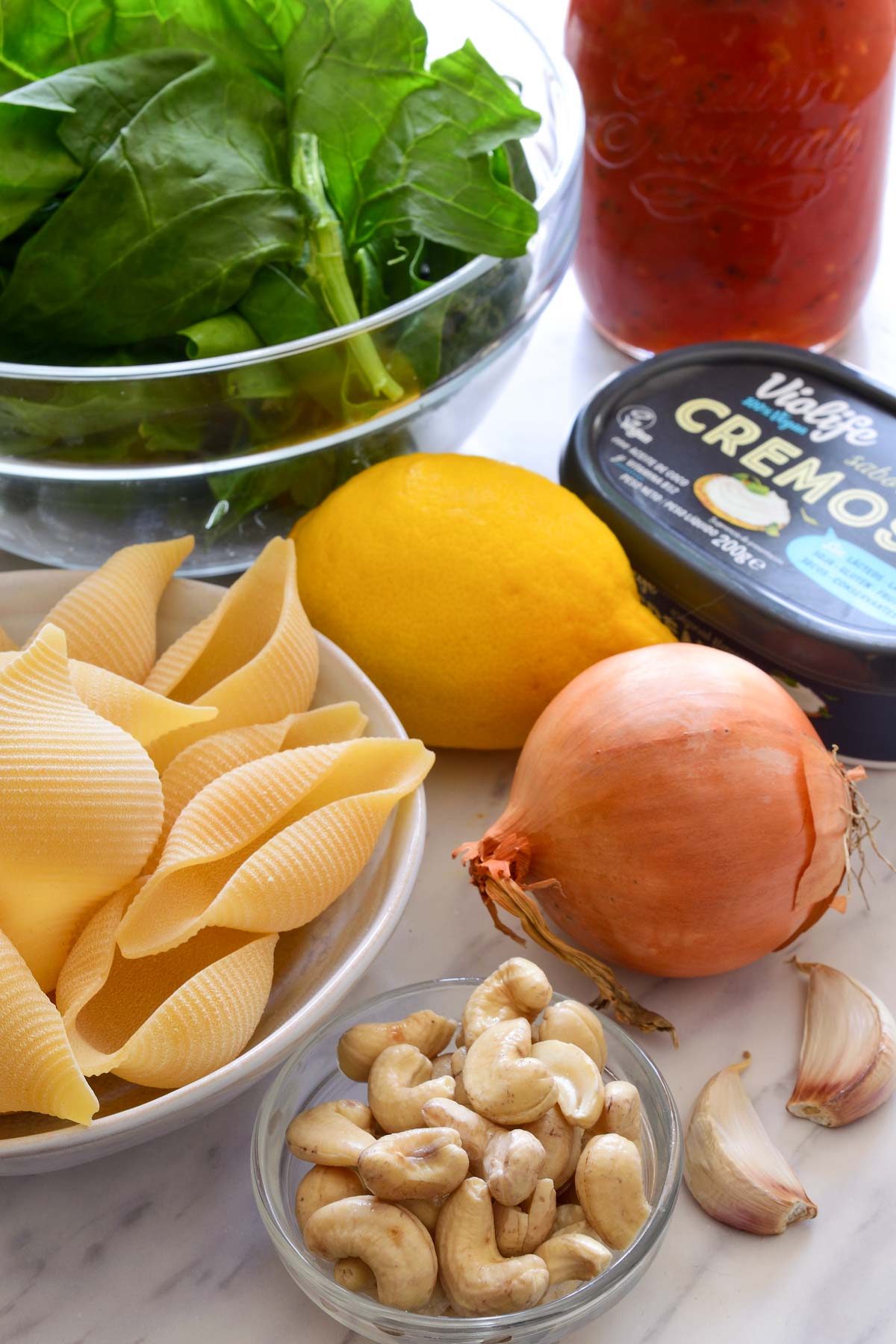 The raw ingredients for vegan stuffed shells displayed on the counter.