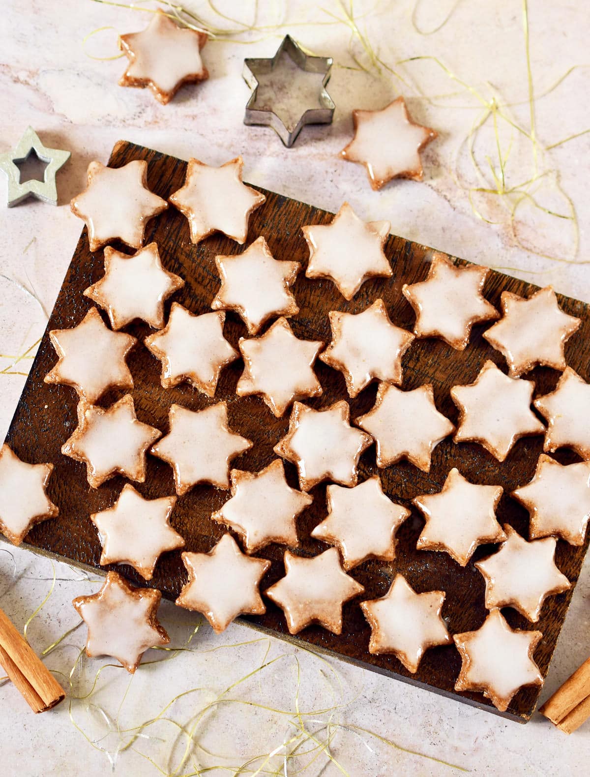Star-shaped vegan cookies on a wooden board.