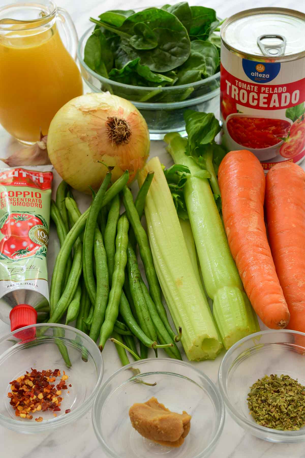 The raw ingredients for this vegetarian tortellini soup on the counter.